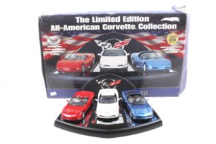 Three 1:24 scale Franklin Mint All American Corvette Collection diecast models.