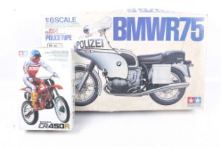 Two Tamiya motorcycle model kits.