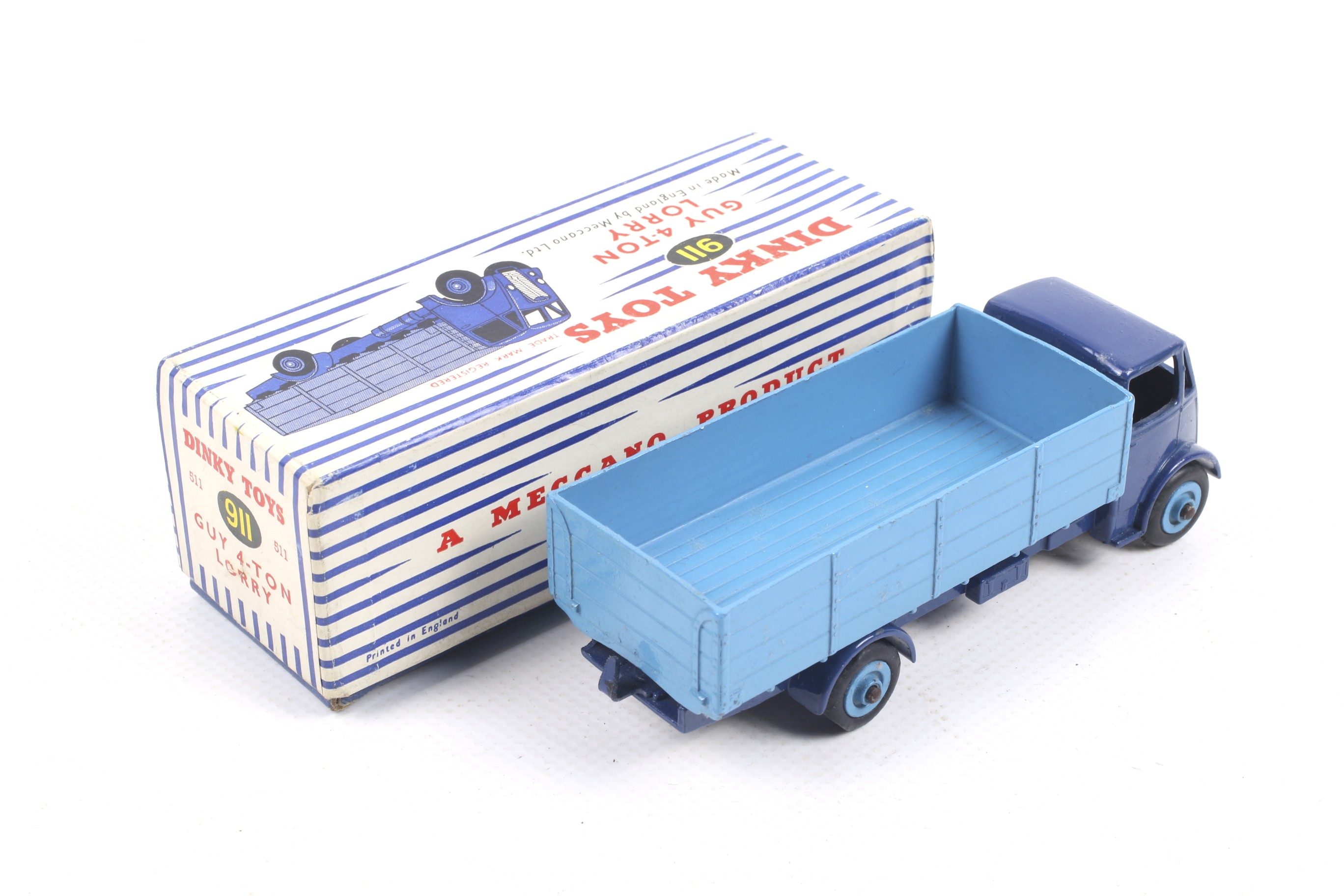 A Dinky diecast Guy 4-Ton Lorry. No. 911 dark blue lorry with light blue bed, in original box. - Image 2 of 2