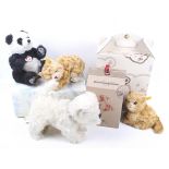 A collection of four Steiff animal teddy bears.
