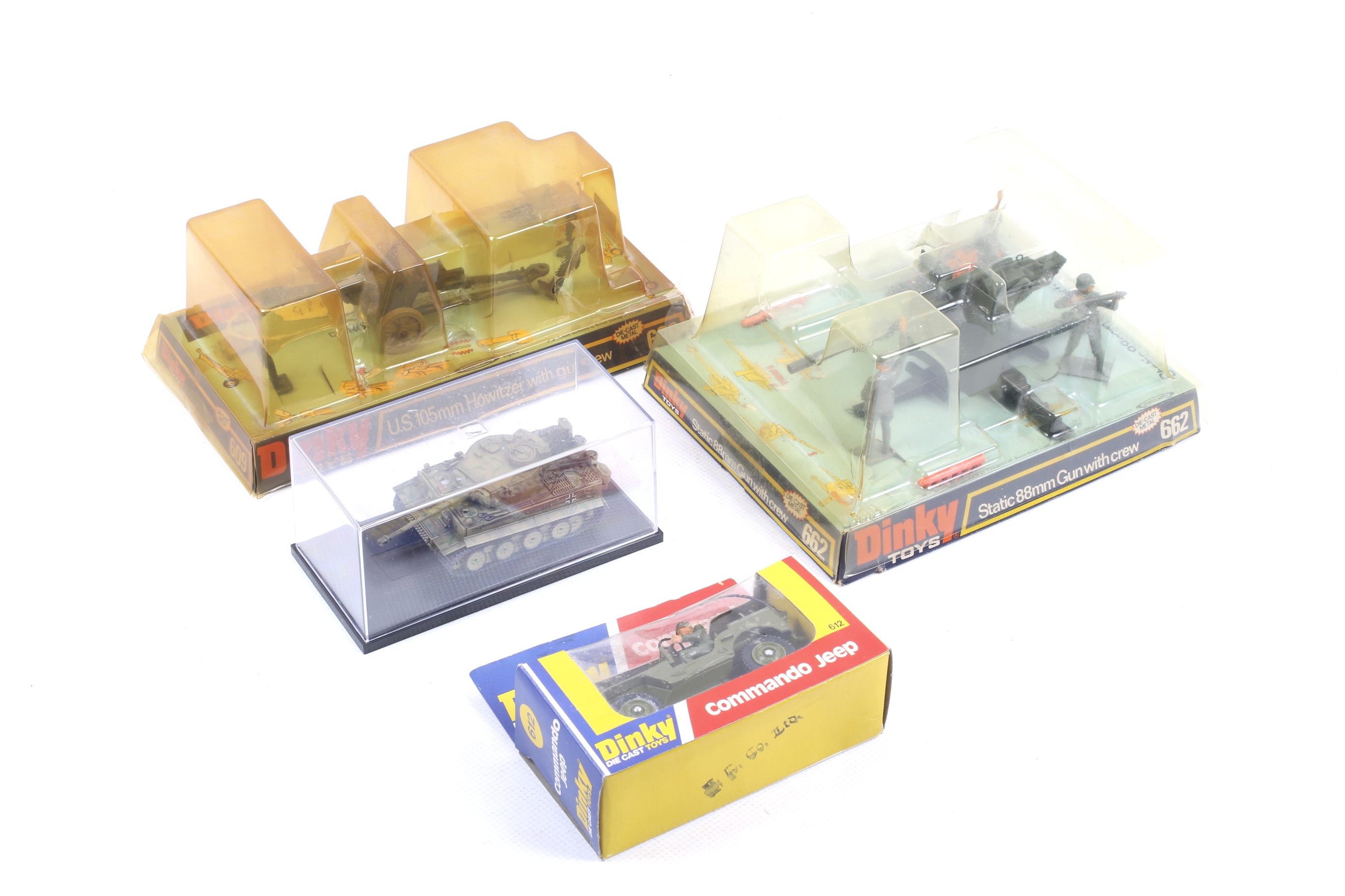Four military diecast models. Comprising two Dinky field guns and crew nos.