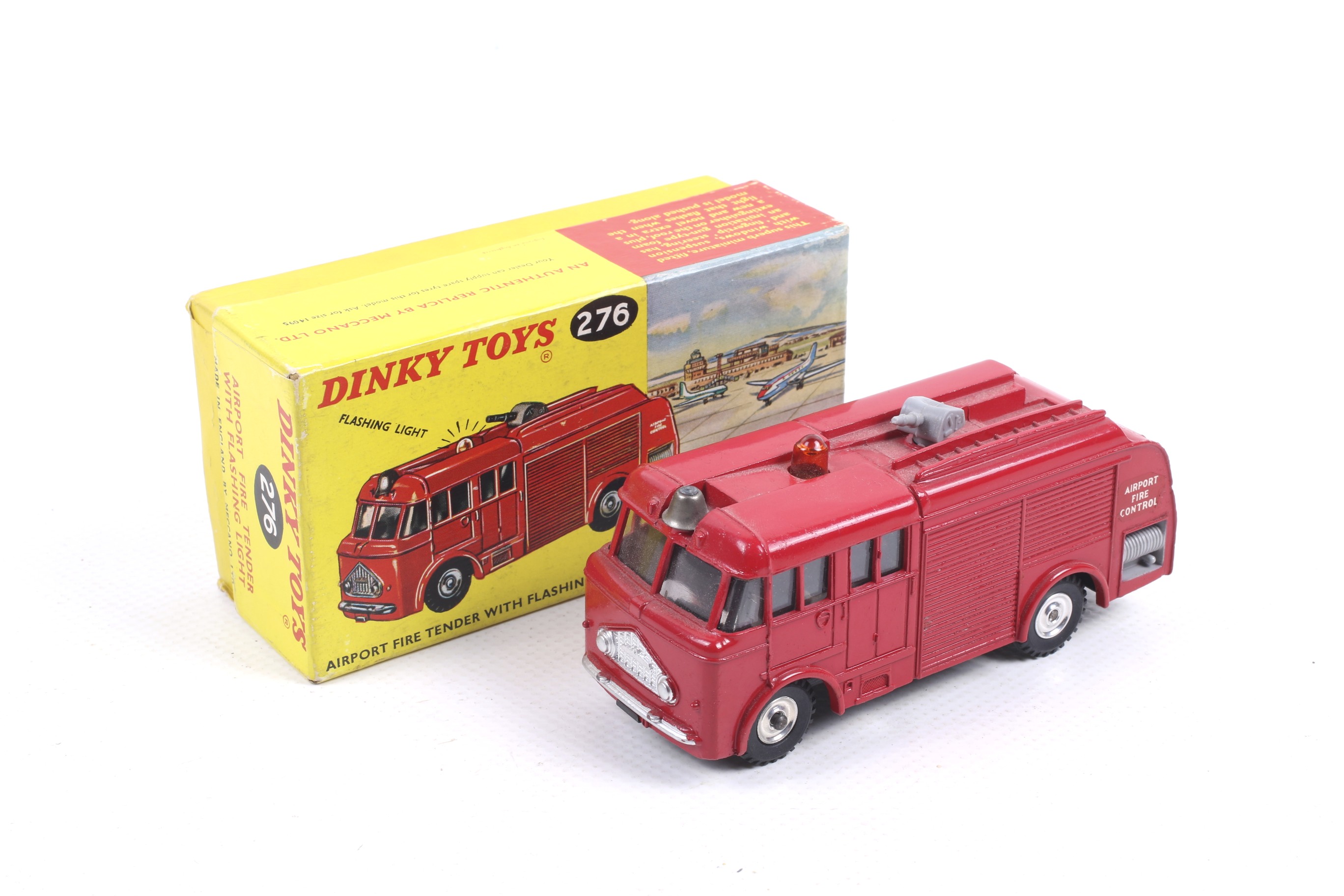 A Dinky diecast Airport Fire Tender. No. 276, red body with beacon, in original box.