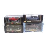 Four 1:18 scale diecast cars.