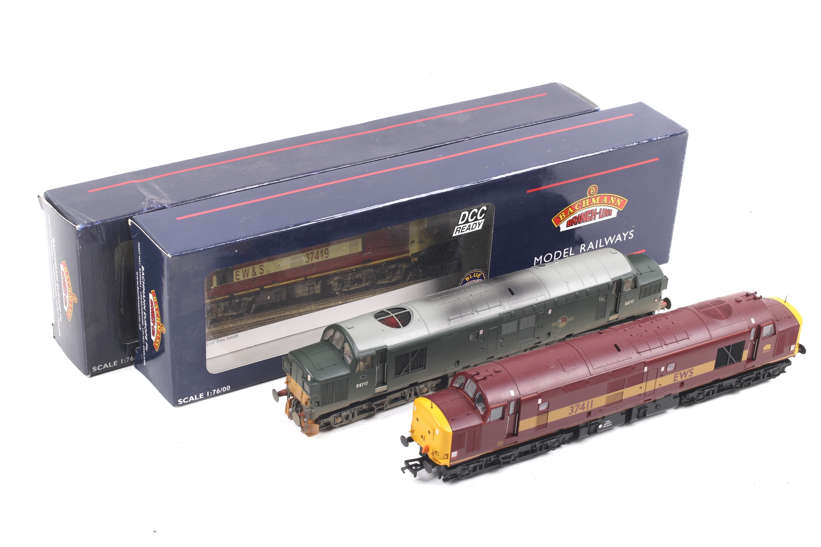 Two Bachmann class 37 OO gauge diesel locomotives. Comprising one in BR green with weathering no.