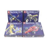 A collection of four Lego Technics sets. Comprising one racing car no.