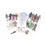 A collection of 1970s/90s Star Wars action figures.