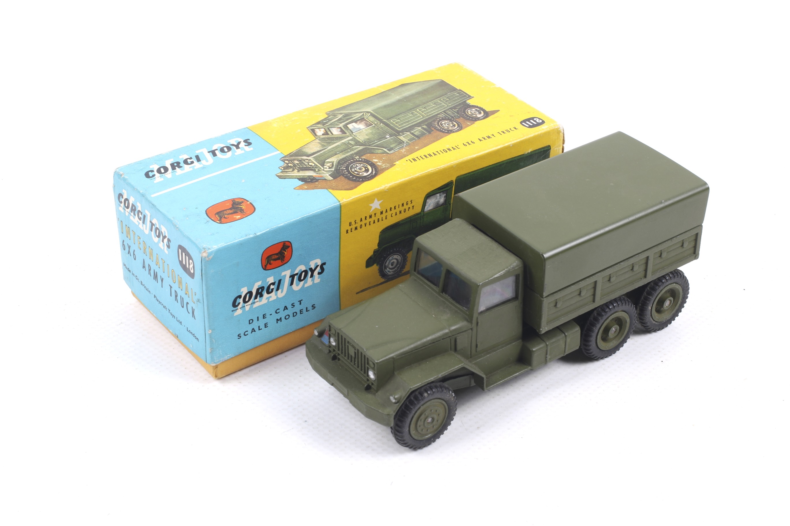 A Corgi diecast International 6x6 Army Truck. No. 1118, green body and wheels, in original box.