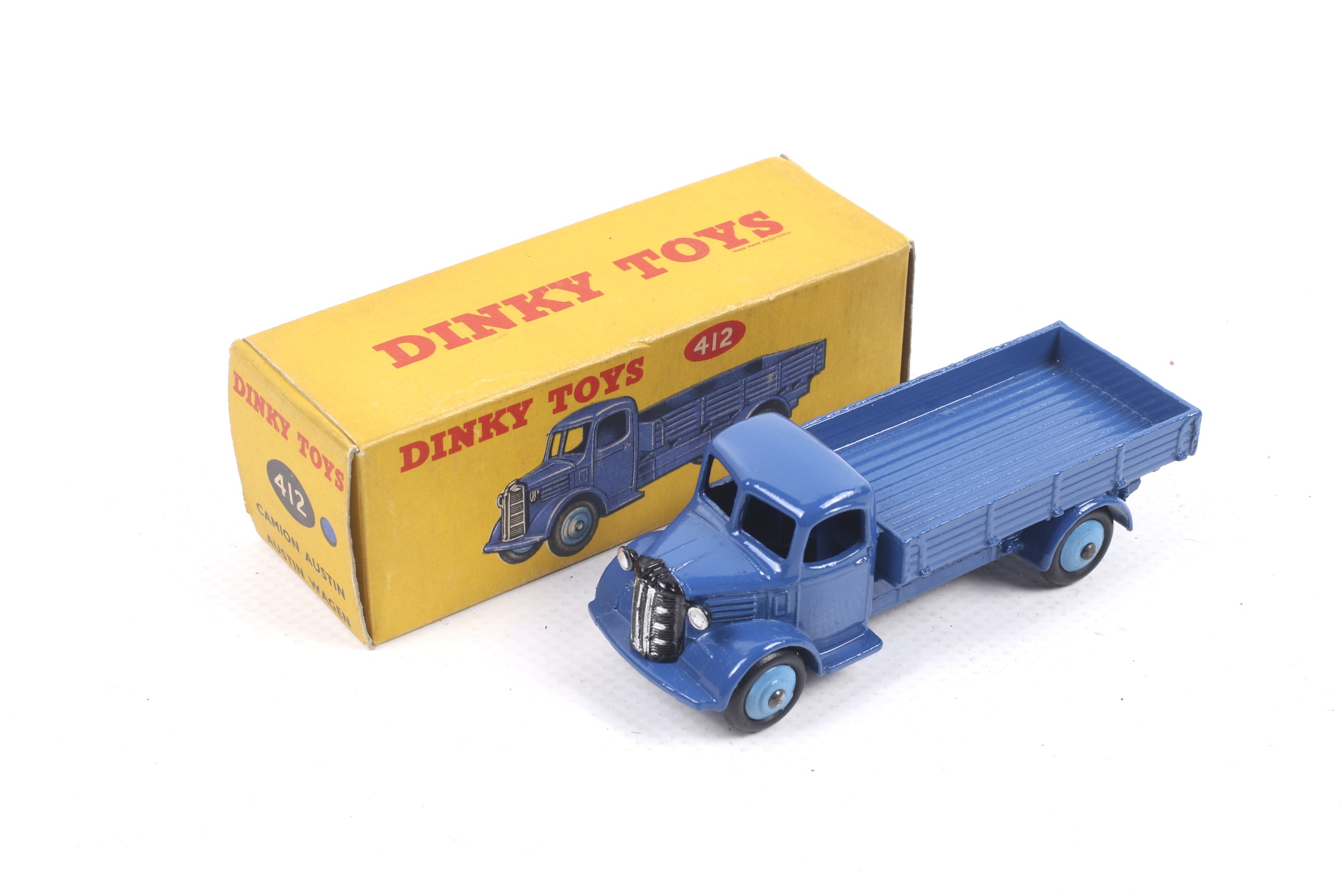A Dinky diecast Austin Wagon. No. 412, dark blue body with light blue wheels, in original box.