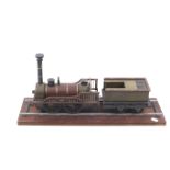 A scratch built wooden model of a steam locomotive and tender.