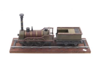 A scratch built wooden model of a steam locomotive and tender.