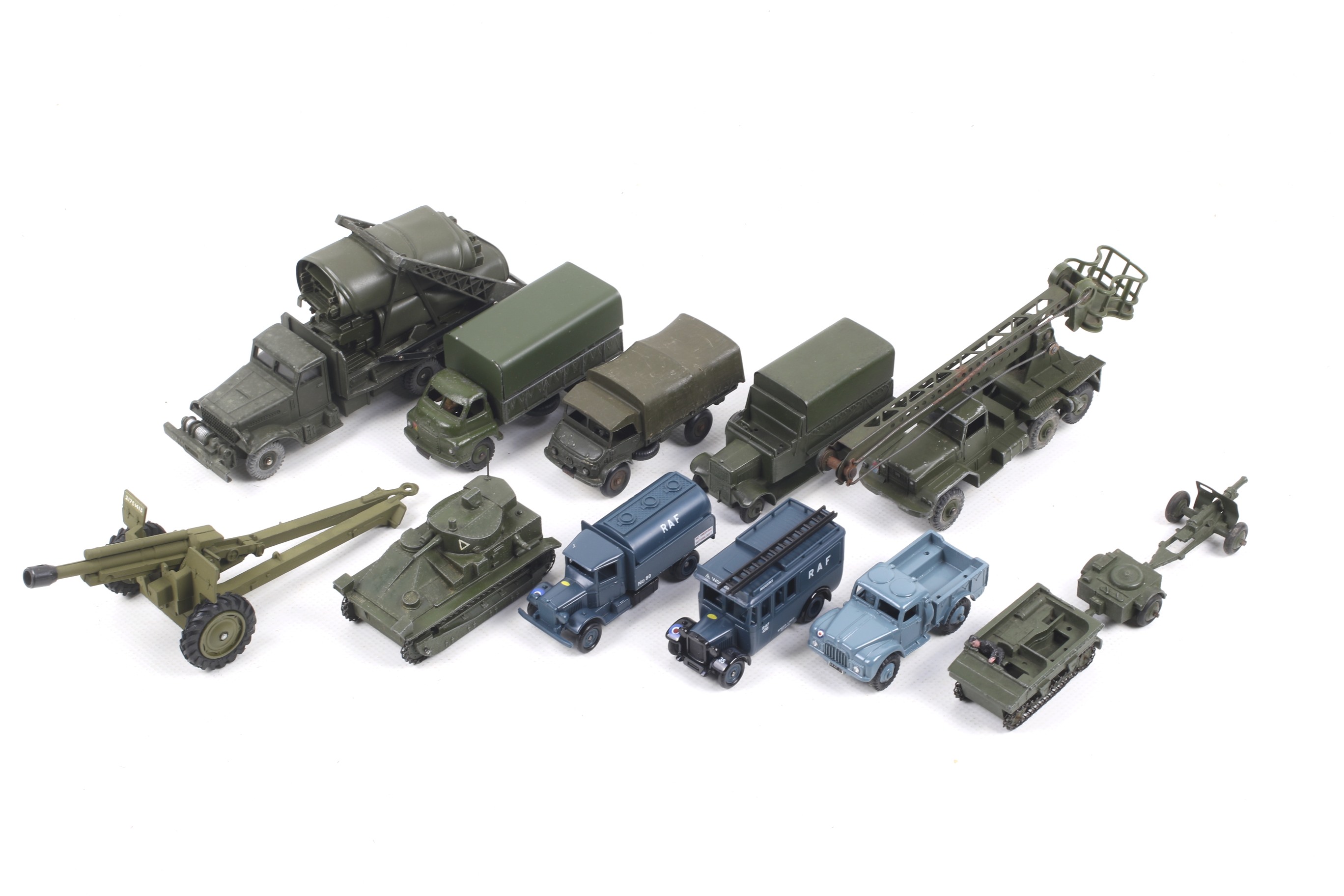 Ten diecast military vehicles. From Dinky and Corgi, noting trucks and field guns etc, all unboxed.