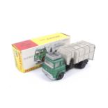 A Dinky diecast refuse lorry. No. 978, green body and black bed, in original box.