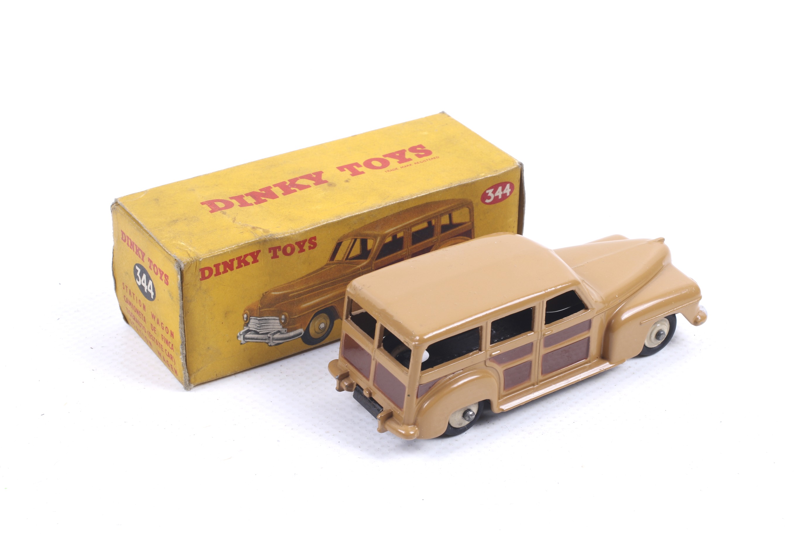A Dinky diecast Estate Car. No. 344, with a tan and brown body with white wheels, in original box. - Image 2 of 2