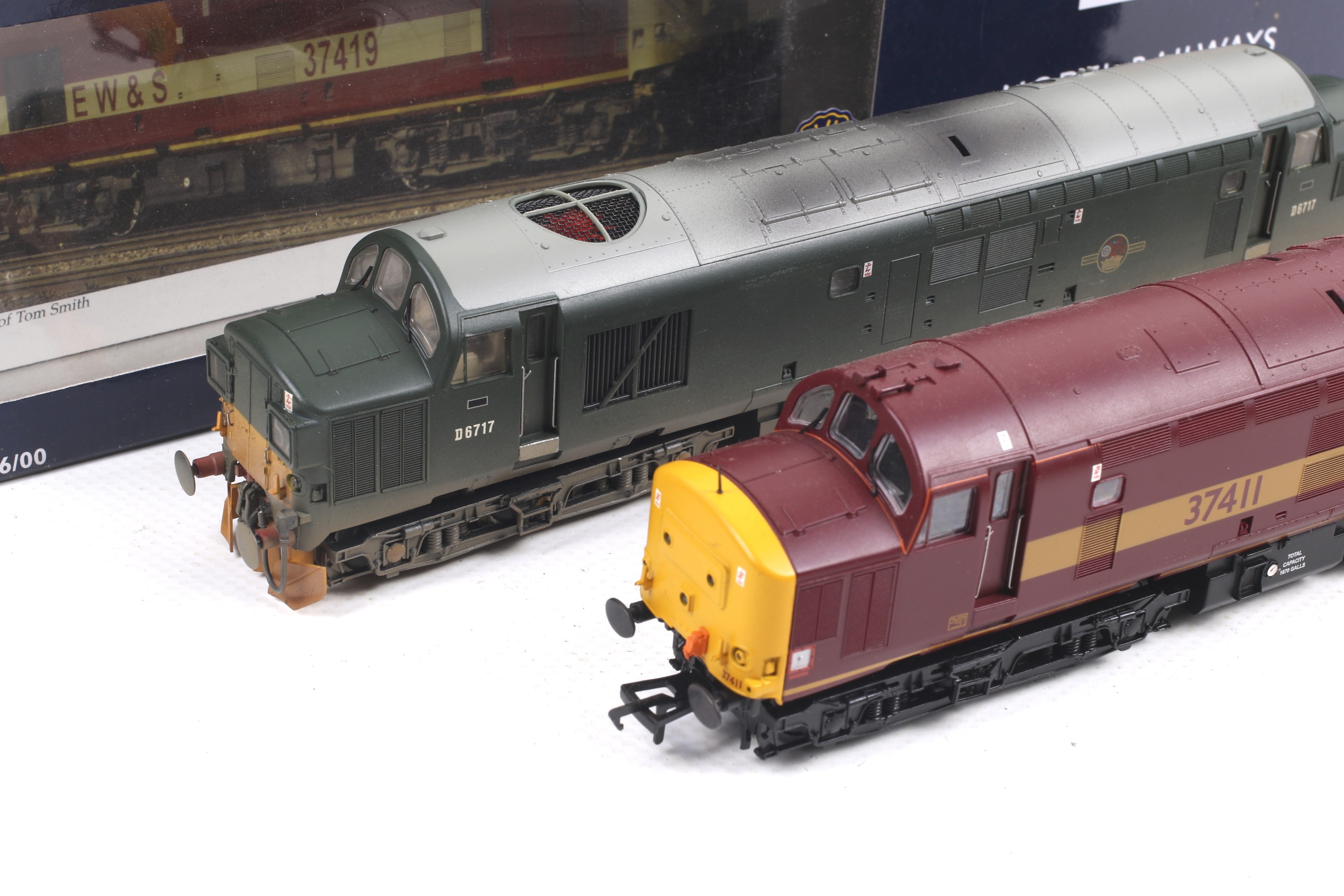 Two Bachmann class 37 OO gauge diesel locomotives. Comprising one in BR green with weathering no. - Image 2 of 2