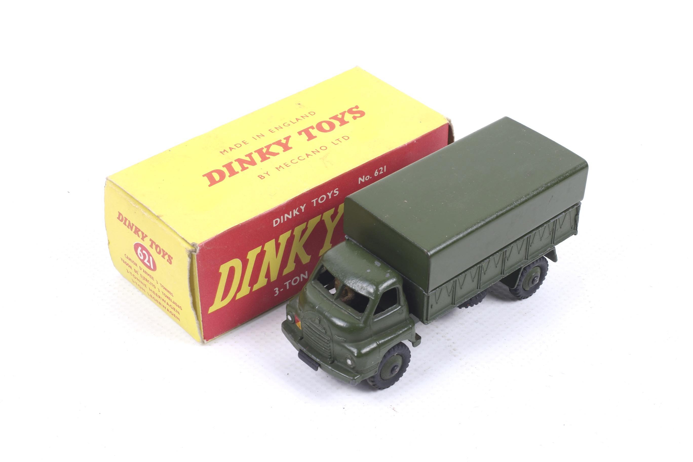 A Dinky diecast 3 ton Army Wagon. No. 621, green body complete with driver, in original box.