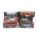 Six 1:18 scale diecast cars.