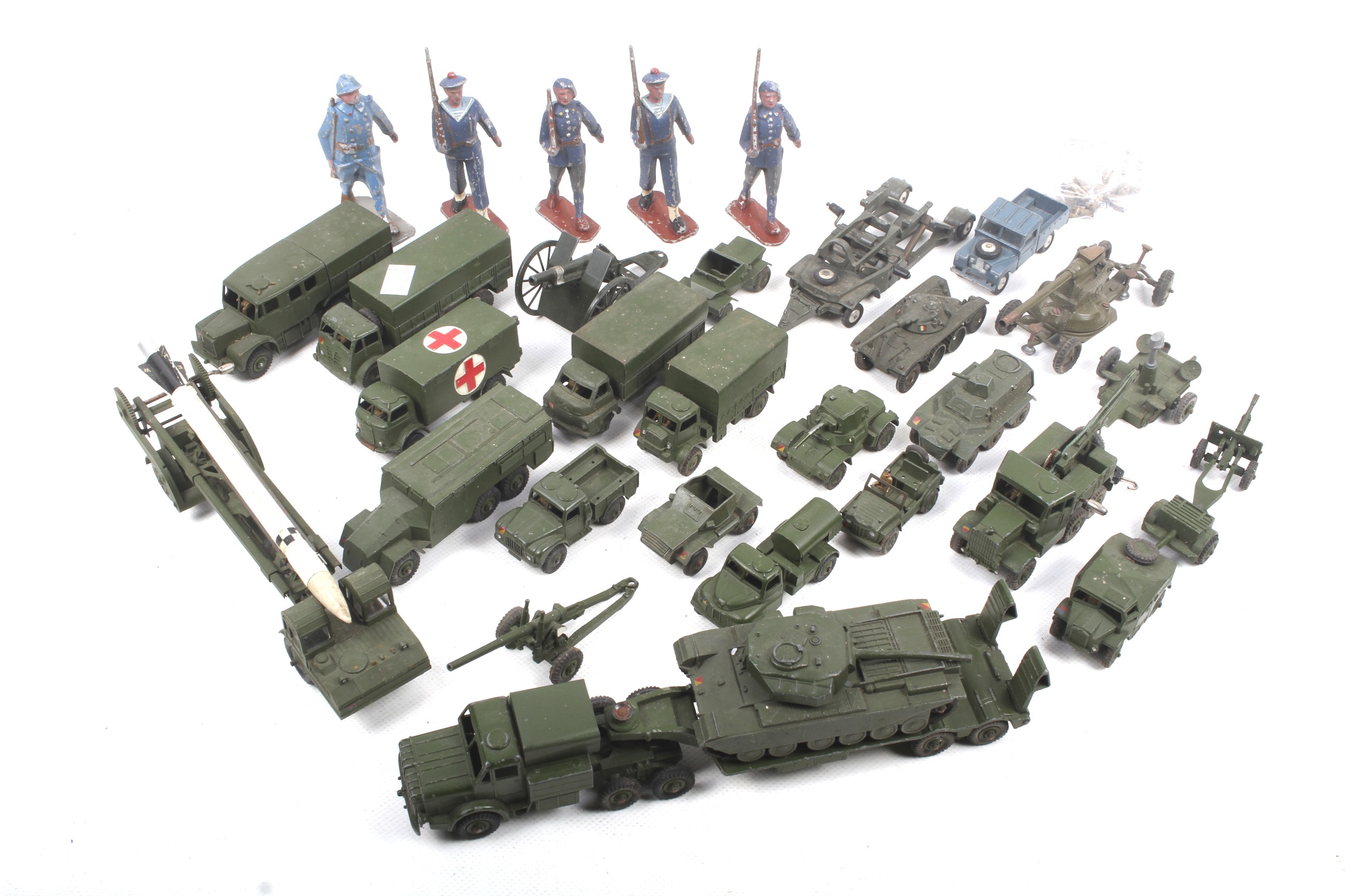 A collection of diecast metal military vehicles and accessories.
