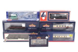 Seven mainly Bachmann OO gauge goods wagons and coaches.
