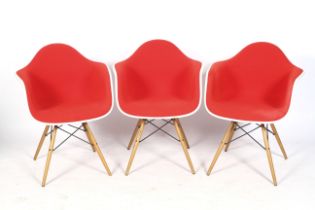 A set of three Charles and Ray Eames for Vitra armchairs.