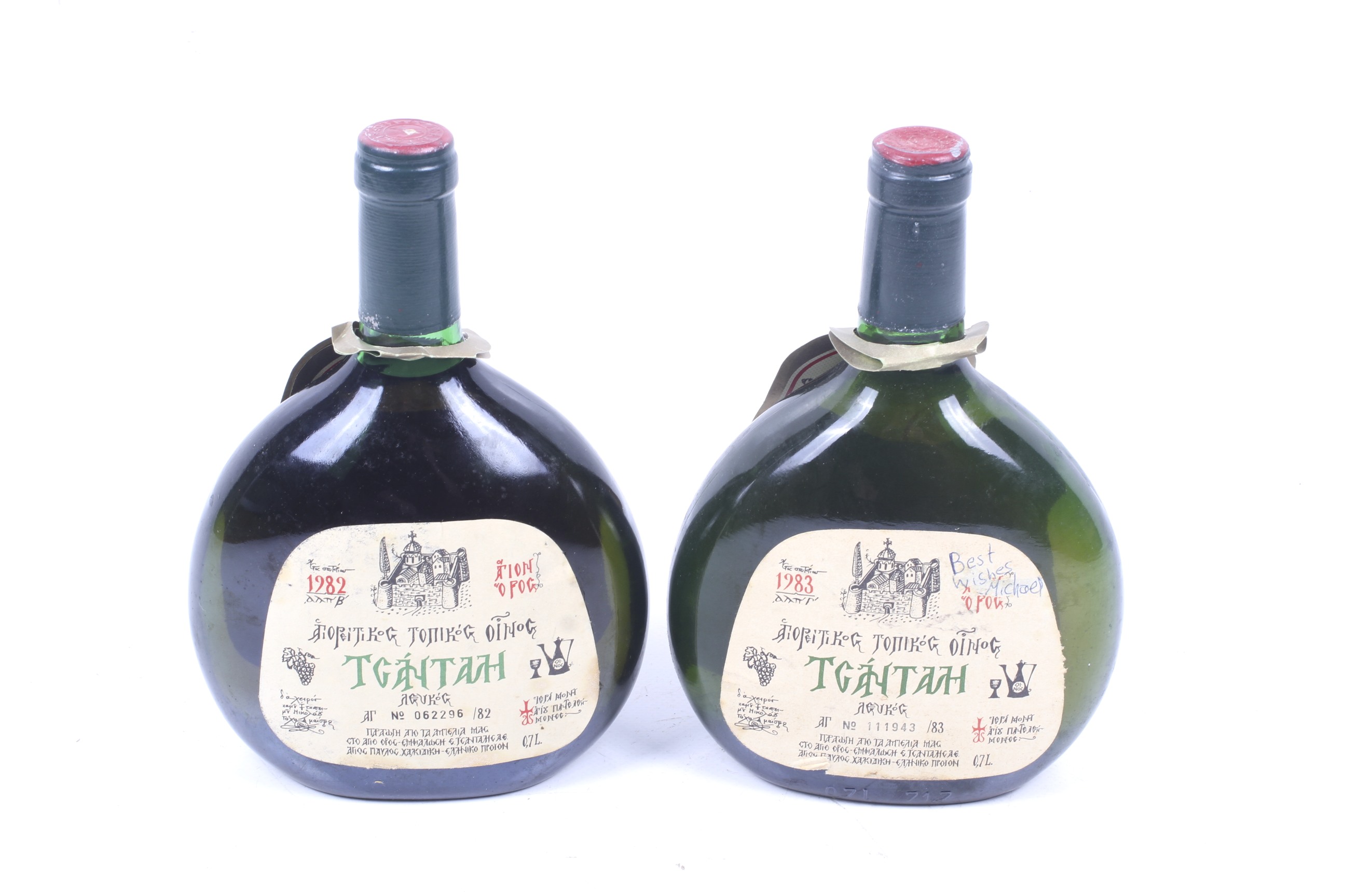 Two bottles of Tgantah white wine. From Greece, one 1982 and one 1983 both 70cl, no vol shown.