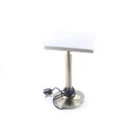 A Lloytron contemporary table lamp. Model L639, with a brass stand and glass shade. Max. H38.