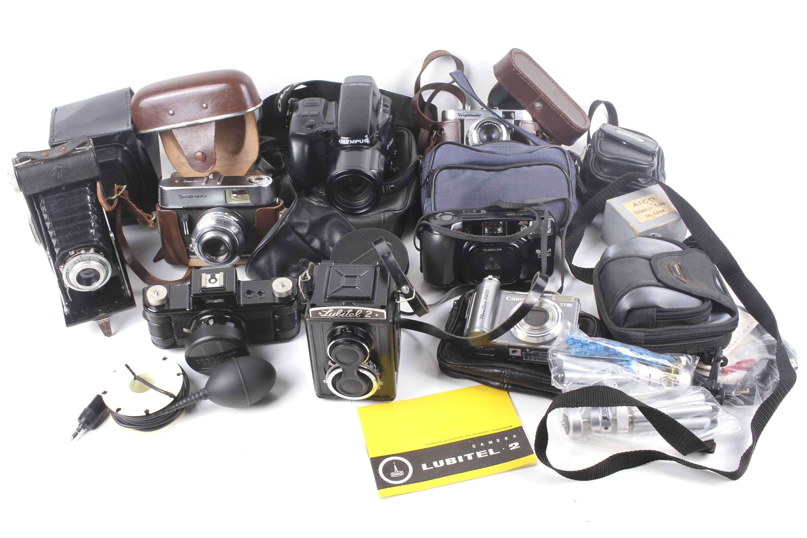 A collection of assorted vintage film and digital cameras.