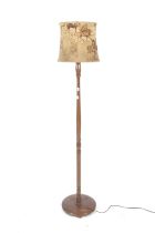 An early 20th century wooden standard lamp.
