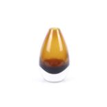 A contemporary retro teardrop shaped cased glass vase. Golden brown upper and clear glass base.