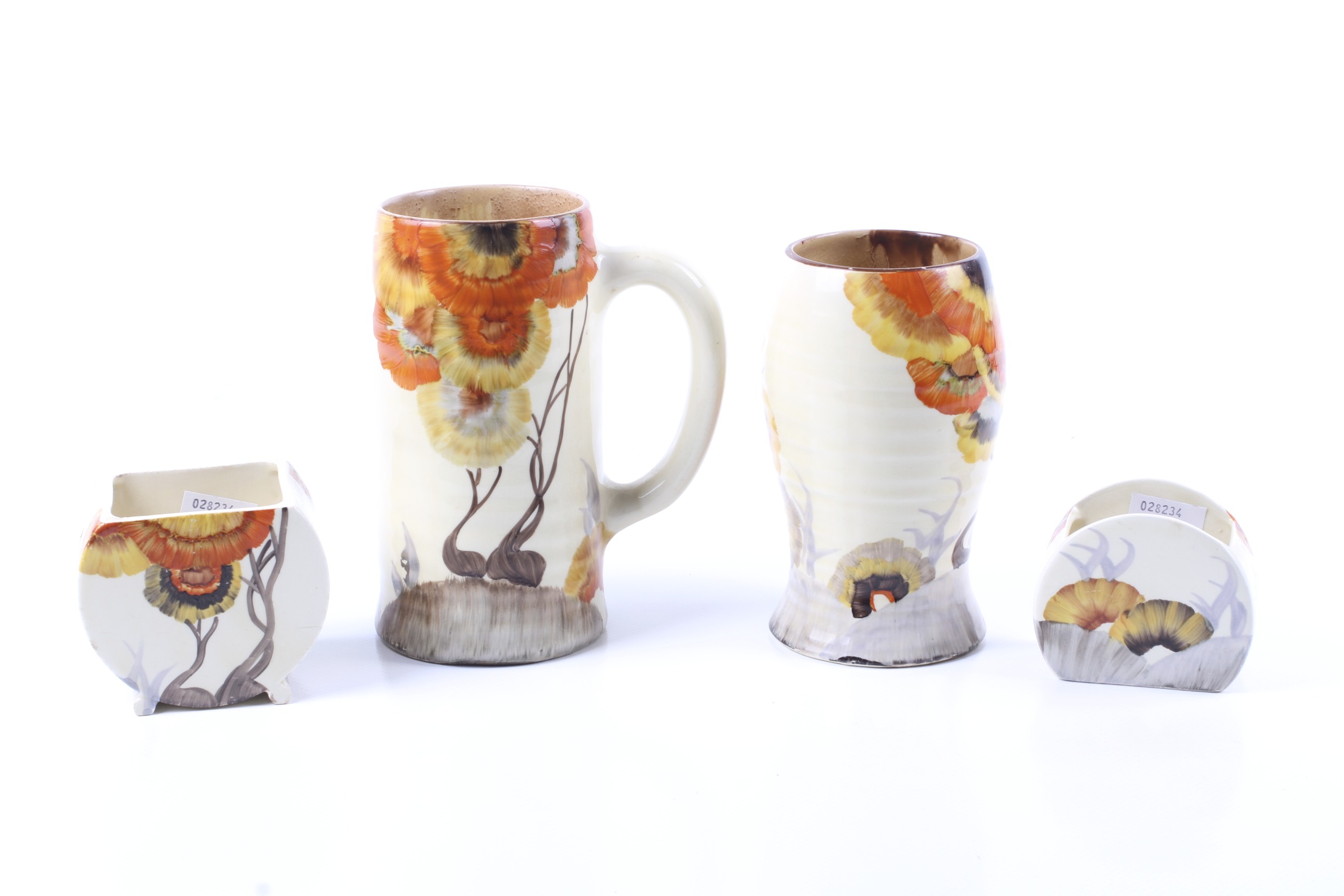 Four pieces of Clarice Cliff Bizarre in the 'Rodanthe' pattern.