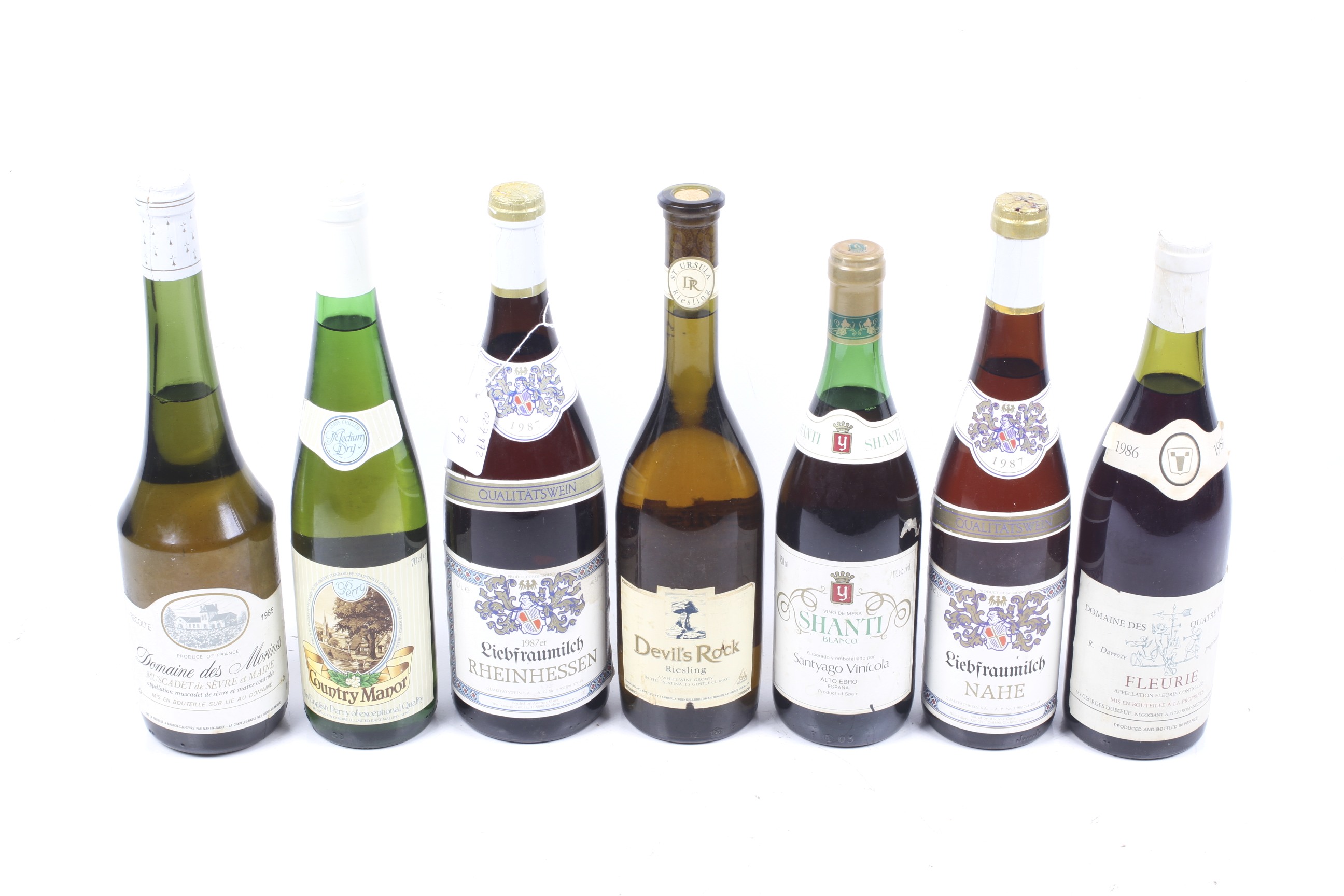 A collection of seven bottles of wine.