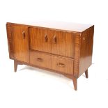 A mid-century E Gomme G-Plan sideboard.