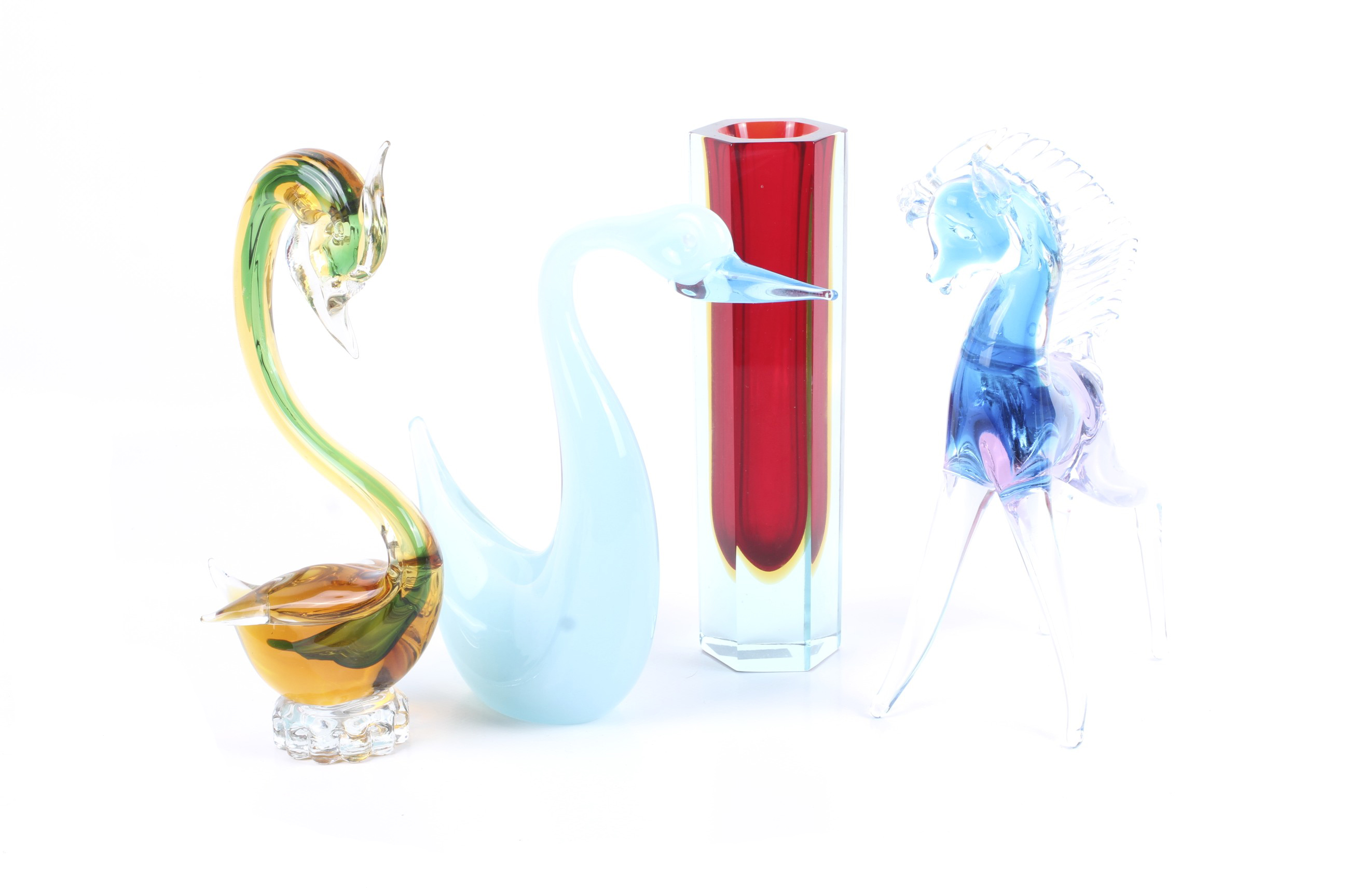 A group of four mid-century coloured glass items.