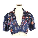 A 20th century Asian hand stitched bolero. With short sleeves, a long collard and single fastening.