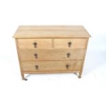 A 20th century oak chest of drawers.