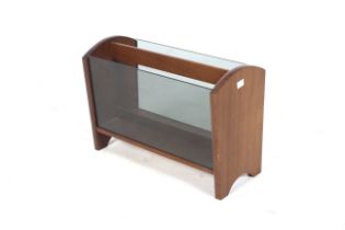 A mid-century teak magazine rack.