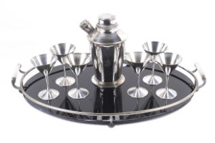 Art Deco EPNS cocktail set. Including shaker, six cocktail goblets and a black glass oval tray. Max.