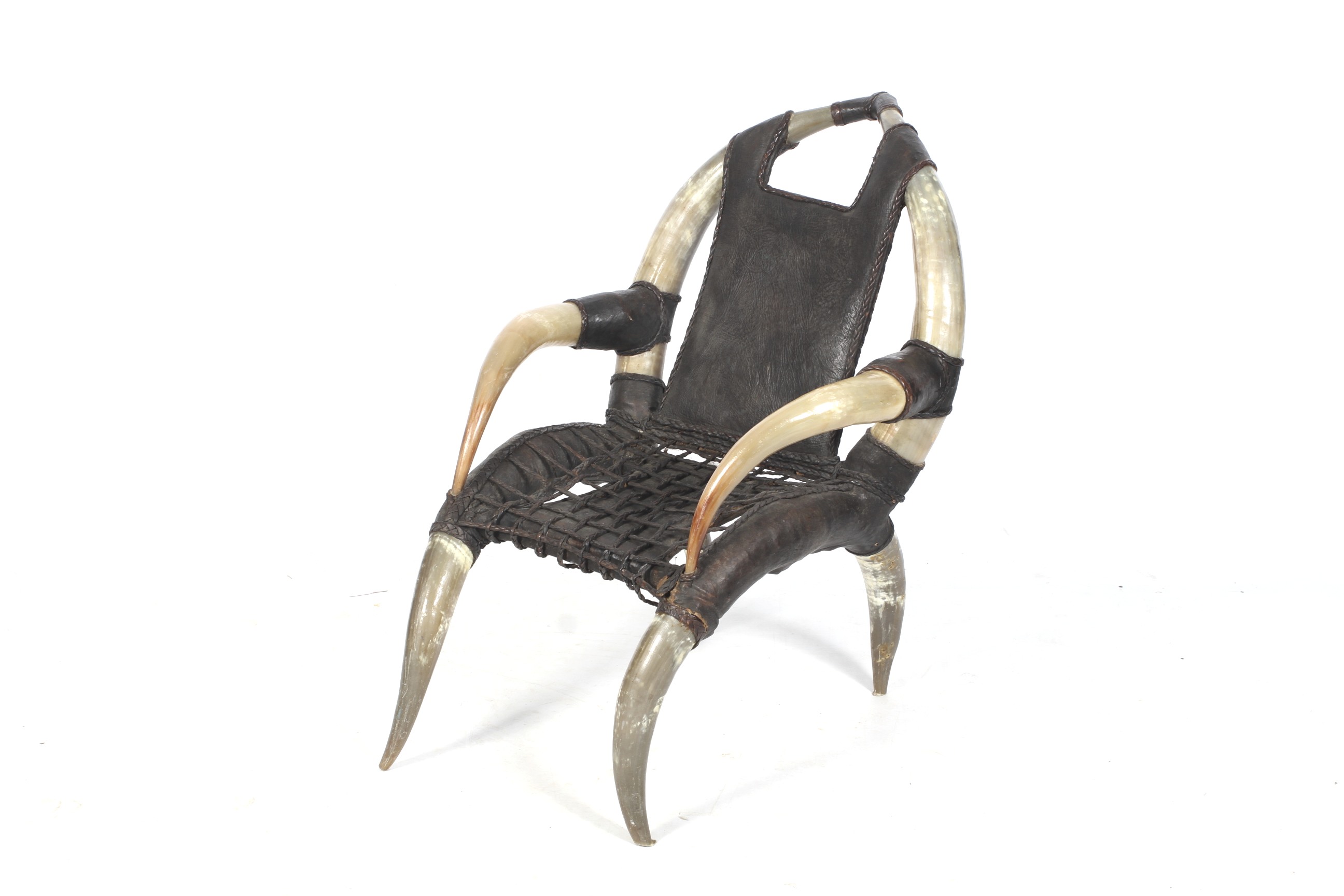 A 20th century cow horn and leather armchair in the manner of Michel Haillard.