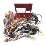 A collection of vintage toy guns and accessories.