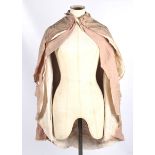 An early 20th century pink cotton shoulder cape.