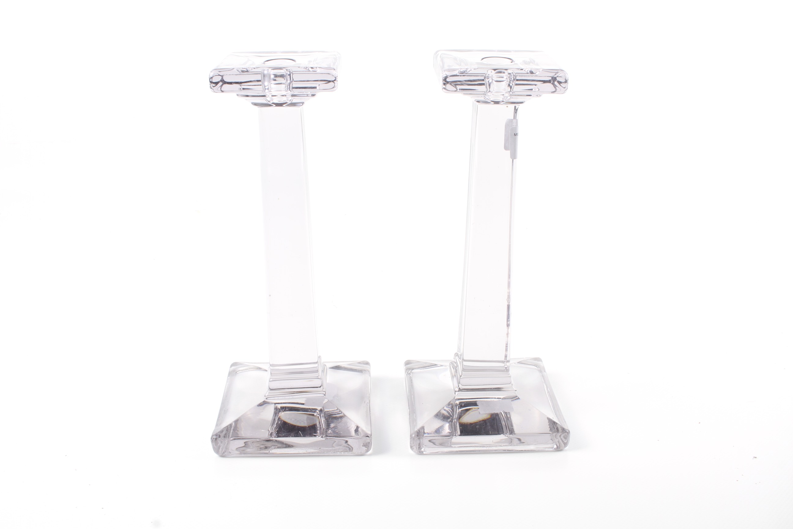 A pair of glass candlesticks. In a tinted grey colour, with a tapered stand and square base. - Image 2 of 2