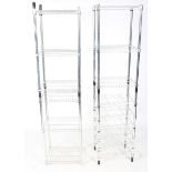 A pair of stainless steel freestanding kitchen racks.