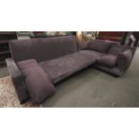 A large contemporary adjustable corner sofa and footstool.