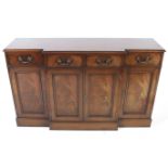 A reproduction Georgian style mahogany breakfront sideboard.