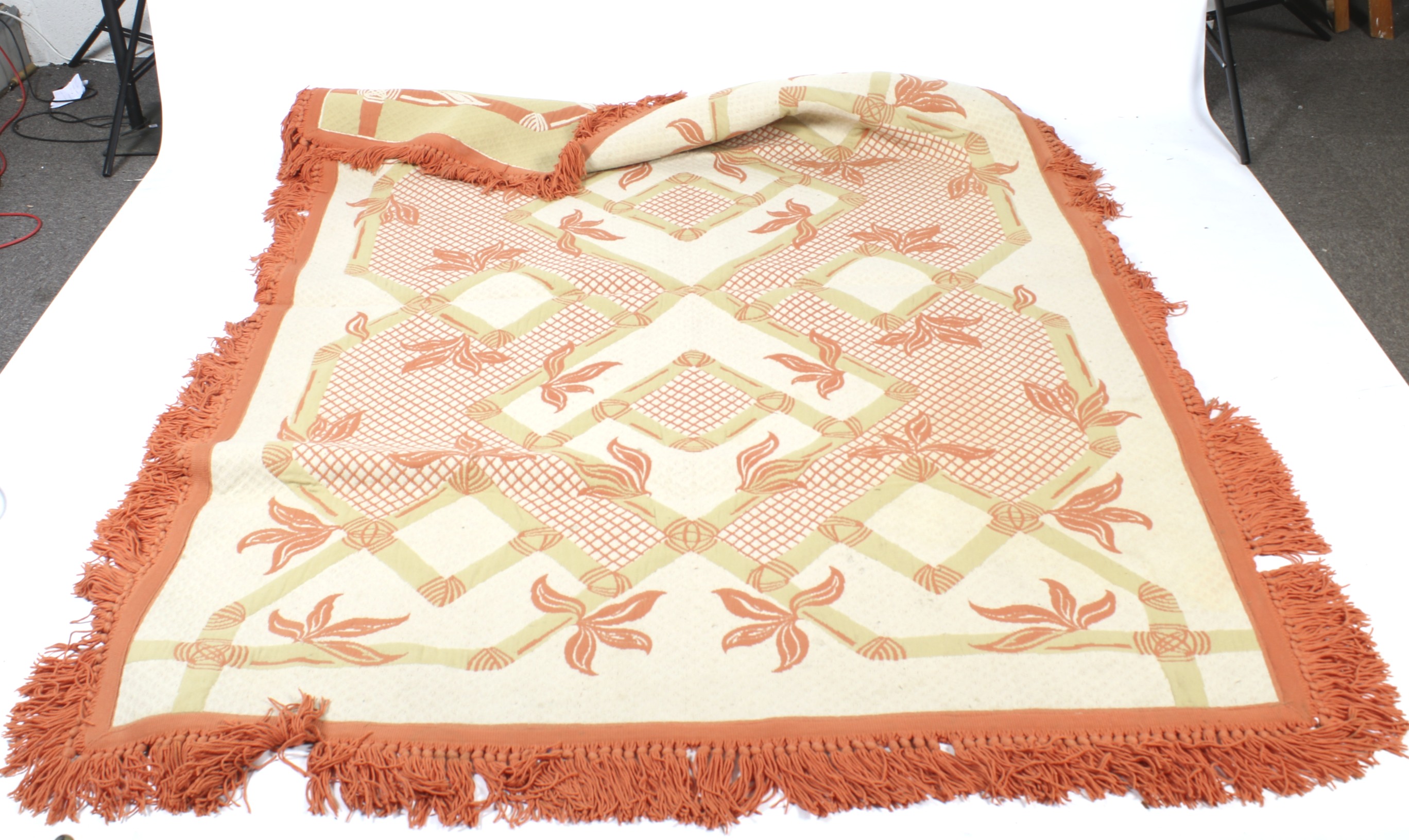A contemporary yellow and orange double side wool bedspread. With orange tassle fringe.