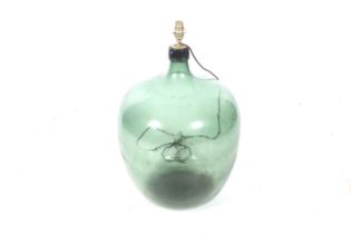A large glass carboy lamp base.