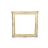 A large contemporary antique style gilt moulded picture frame.