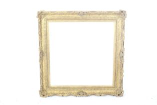 A large contemporary antique style gilt moulded picture frame.