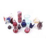 A collection of thirteen assorted coloured glass ornaments.