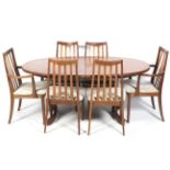 A vintage style oval extendable table and six chairs.