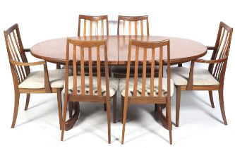 A vintage style oval extendable table and six chairs.